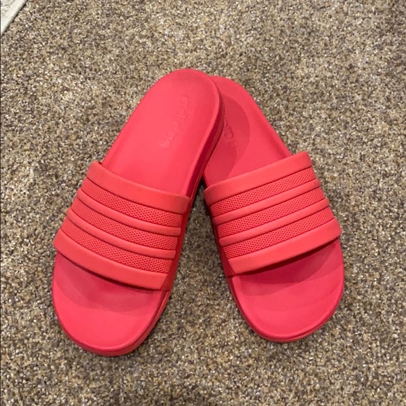 red and pink adidas slides